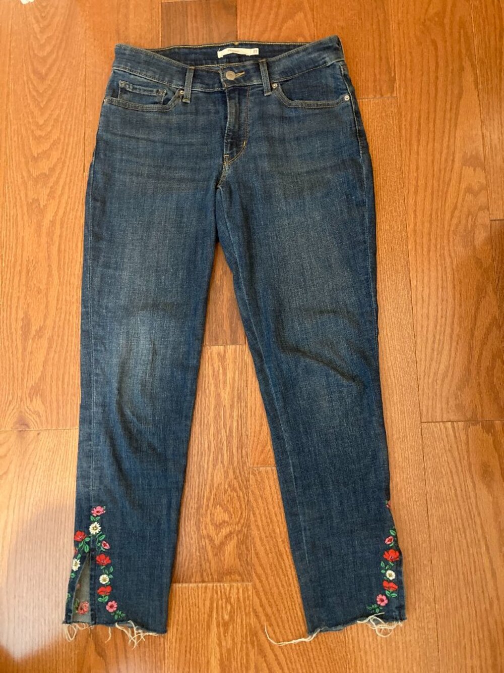 Levi's 711 Skinny Floral Embroidered raw hem jeans